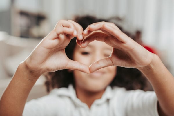 Girl making a heart with her hands
