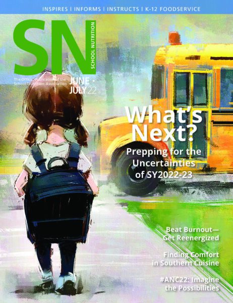 Cover of School Nutrition magazine showing a little girl wearing a backpack and a school bus