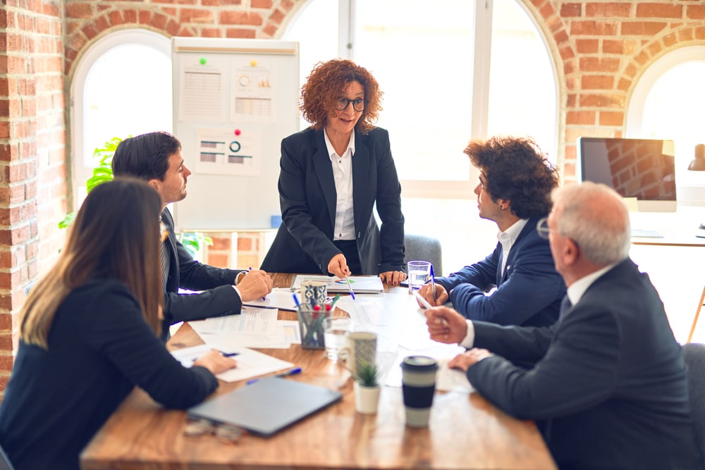 Group,Of,Business,Workers,Working,Together,In,A,Meeting.,Listening