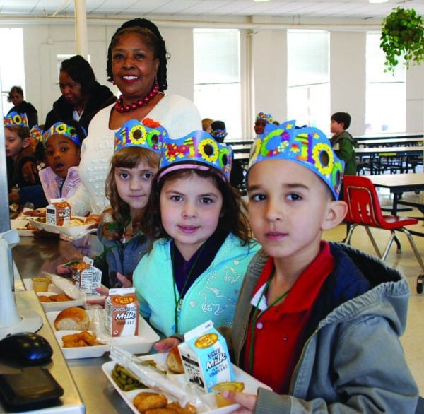 Deborah Carpenter with students in line in the cafeteria