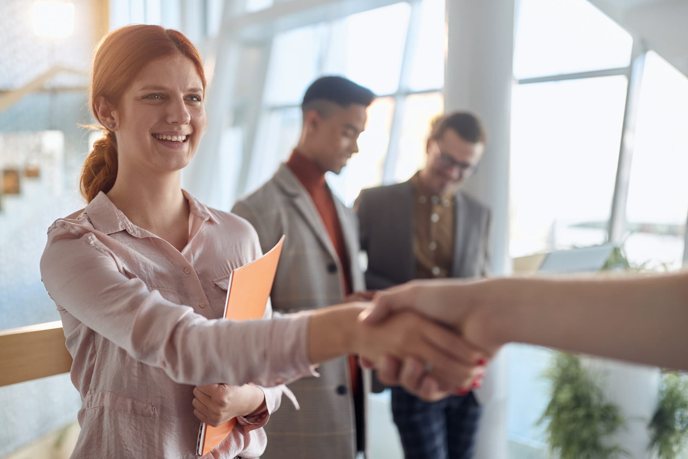 A businesswoman shaking hands