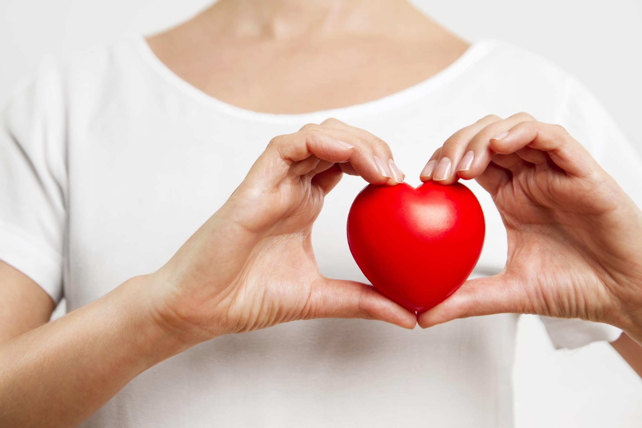 Person holding red heart