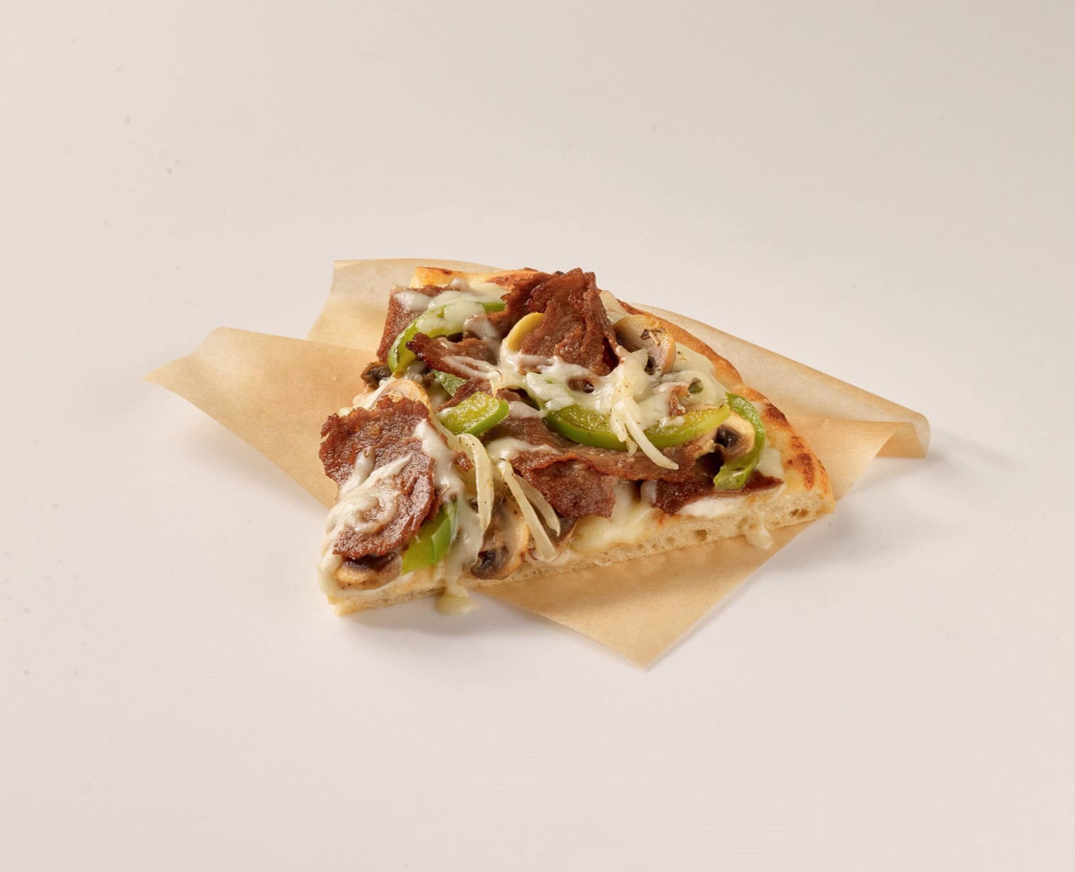 a slice of Philly Cheesesteak Pizza