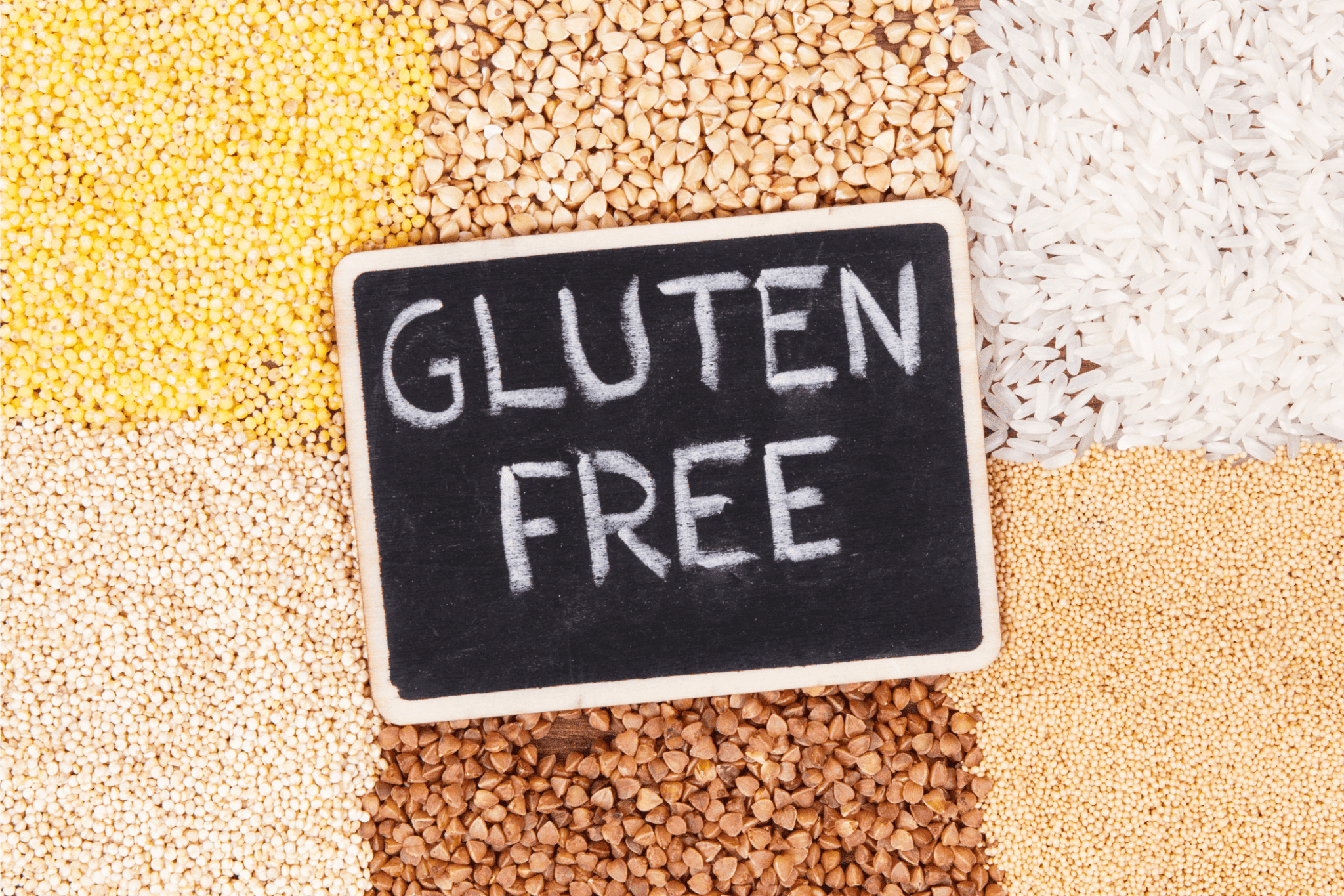 the words "gluten free" on a chalkboard on top piles of various gluten-free grains